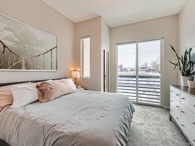 carpeted bedroom with access to exterior