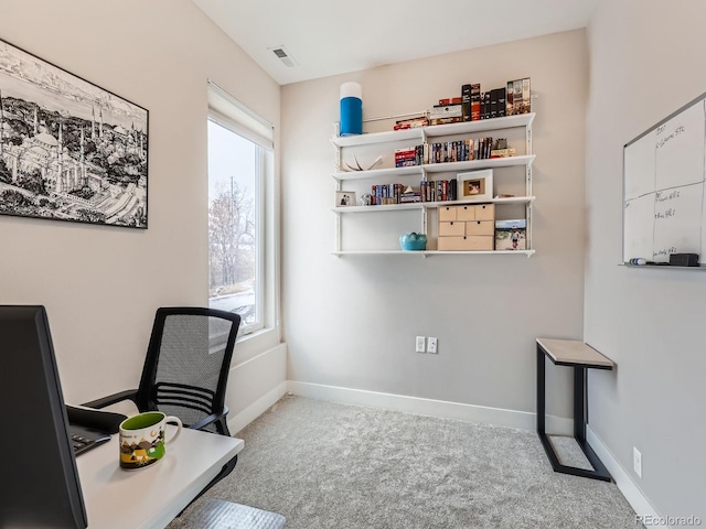 office space featuring visible vents, baseboards, and carpet flooring