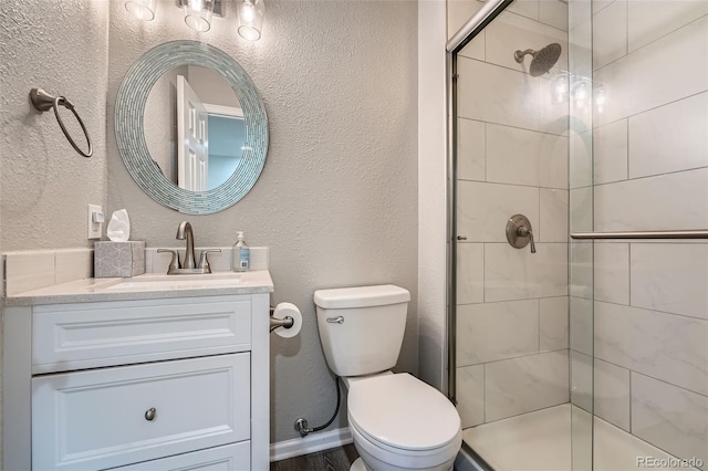 5534 S Wenatchee St, Aurora, CO 80015 - full bathroom with a stall shower, vanity, and a textured wall
