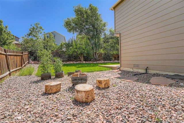 5534 S Wenatchee St, Aurora, CO 80015 - fenced backyard with an outdoor fire pit