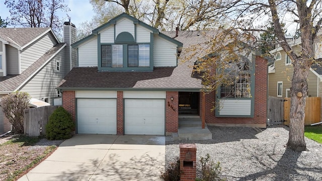 6726 Taft Cir, Arvada, CO 80004 - traditional-style home featuring concrete driveway, an attached garage, fence, and brick siding