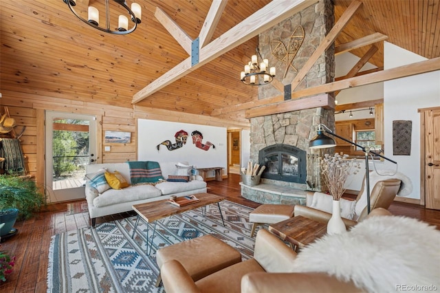 2555 New Mill Gulch Rd, Canon City, CO 81212 - living room featuring a chandelier, high vaulted ceiling, wooden ceiling with exposed beams, a fireplace, and hardwood / wood-style flooring