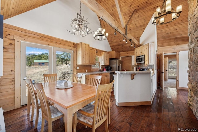 2555 New Mill Gulch Rd, Canon City, CO 81212 - dining space with a chandelier, high vaulted ceiling, wooden ceiling with exposed beams, and dark wood-style flooring