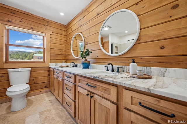 2555 New Mill Gulch Rd, Canon City, CO 81212 - bathroom with double vanity, wood walls, toilet, and stone finish flooring