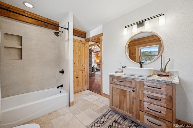 2555 New Mill Gulch Rd, Canon City, CO 81212 - full bathroom featuring vanity, shower / bath combination, and stone tile flooring