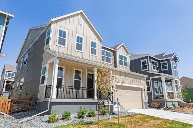 5621 W 141st Ln, Broomfield, CO 80020 - view of front of house featuring a porch, board and batten siding, concrete driveway, and a garage