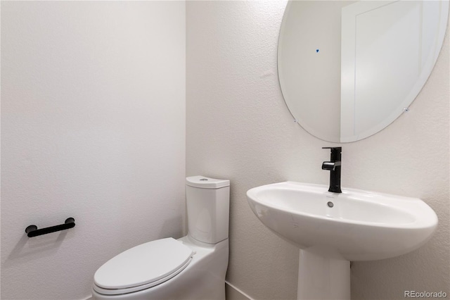 5621 W 141st Ln, Broomfield, CO 80020 - half bathroom featuring toilet and a sink
