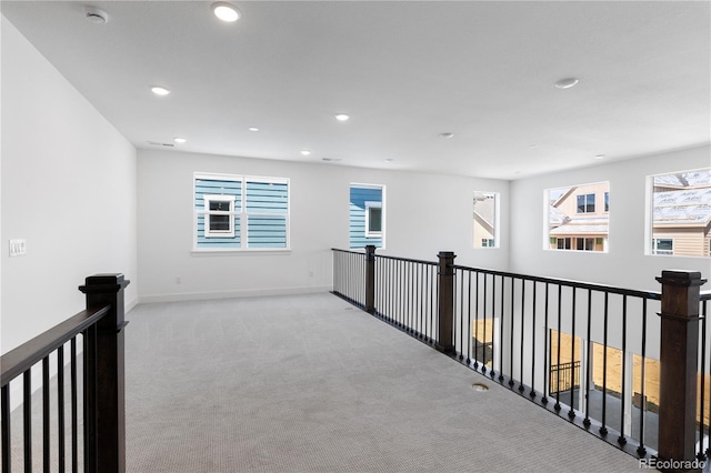 5621 W 141st Ln, Broomfield, CO 80020 - corridor featuring light colored carpet, an upstairs landing, recessed lighting, and plenty of natural light