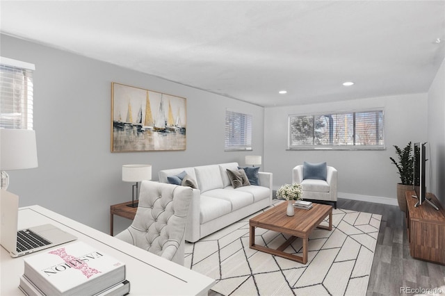 living room featuring recessed lighting, light wood-type flooring, and baseboards