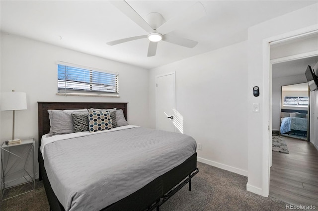 bedroom with baseboards, carpet floors, and a ceiling fan