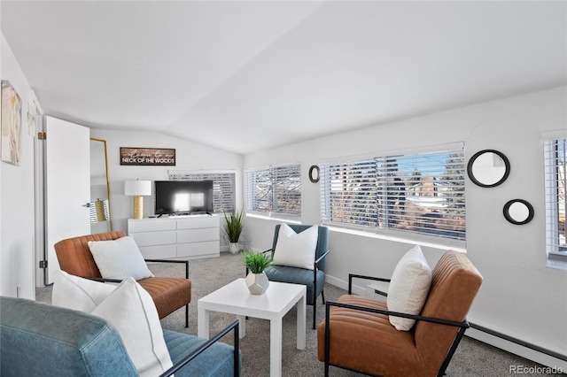 living area featuring baseboard heating, baseboards, lofted ceiling, and carpet floors