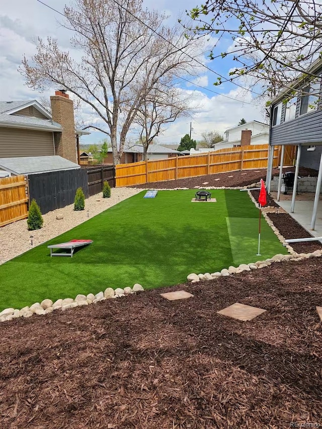 view of yard featuring a patio and a fenced backyard