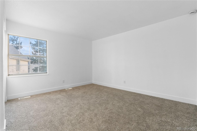 12635 E Pacific Cir Unit A, Aurora, CO 80014 - spare room featuring carpet flooring and baseboards