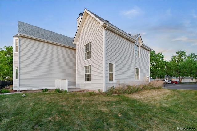 12635 E Pacific Cir Unit A, Aurora, CO 80014 - view of side of property with a lawn and a chimney