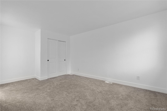 12635 E Pacific Cir Unit A, Aurora, CO 80014 - carpeted empty room with baseboards