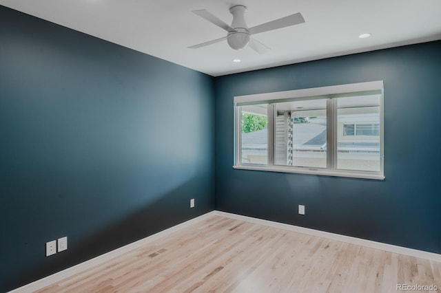 unfurnished room featuring ceiling fan and light wood-type flooring