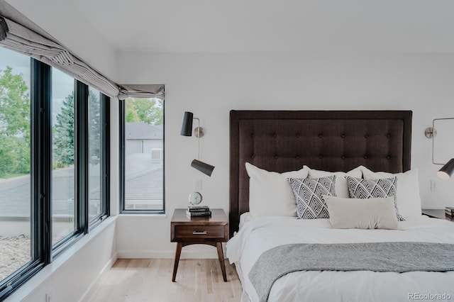 bedroom with light hardwood / wood-style floors