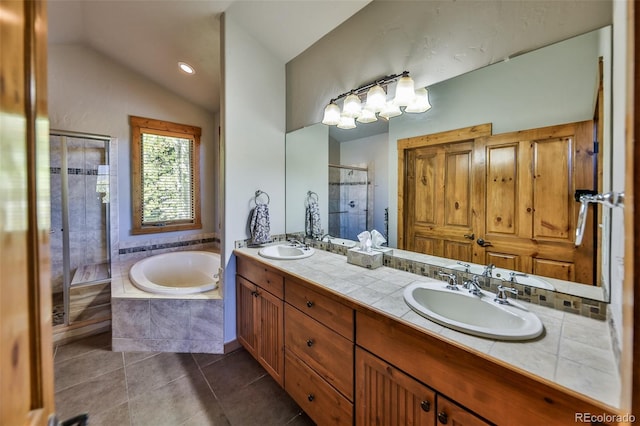 bathroom with vanity, plus walk in shower, tile patterned flooring, and vaulted ceiling