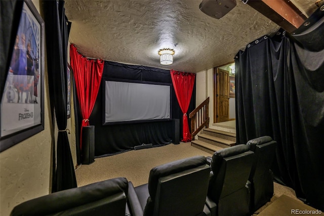 carpeted cinema room featuring a textured ceiling