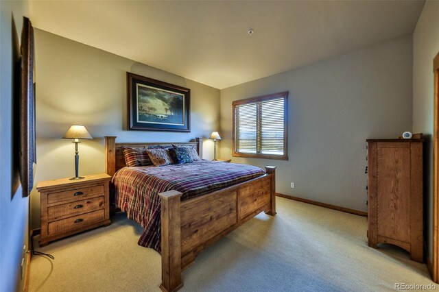 bedroom with light carpet