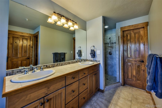 bathroom featuring vanity, tile patterned flooring, and an enclosed shower