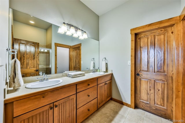 bathroom featuring vanity, tile patterned floors, and an enclosed shower