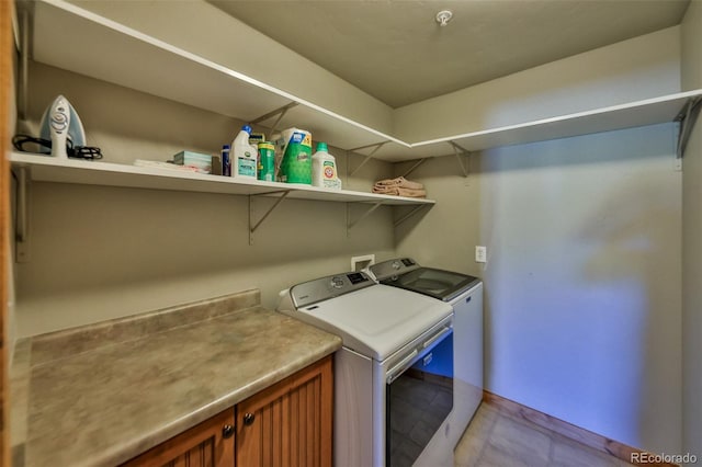 laundry area with independent washer and dryer