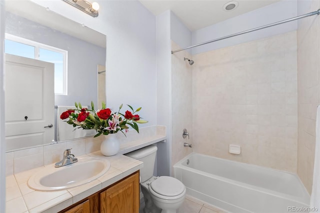 bathroom featuring toilet, shower / bathing tub combination, and vanity