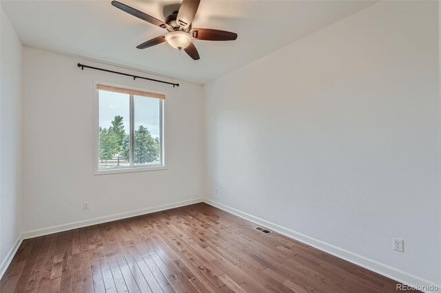 23993 E Briarwood Dr, Aurora, CO 80016 - spare room featuring wood-type flooring and ceiling fan