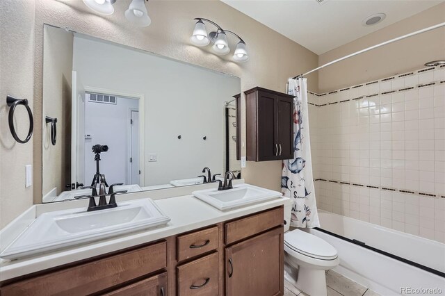 23993 E Briarwood Dr, Aurora, CO 80016 - bathroom featuring double vanity, shower / bathtub combination with curtain, and tile patterned floors