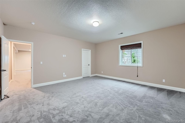 23993 E Briarwood Dr, Aurora, CO 80016 - carpeted empty room with a textured ceiling and baseboards