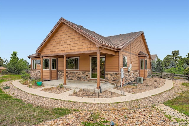 23993 E Briarwood Dr, Aurora, CO 80016 - craftsman-style house with a patio area and stone siding