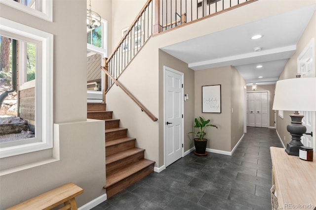 entrance foyer with a chandelier