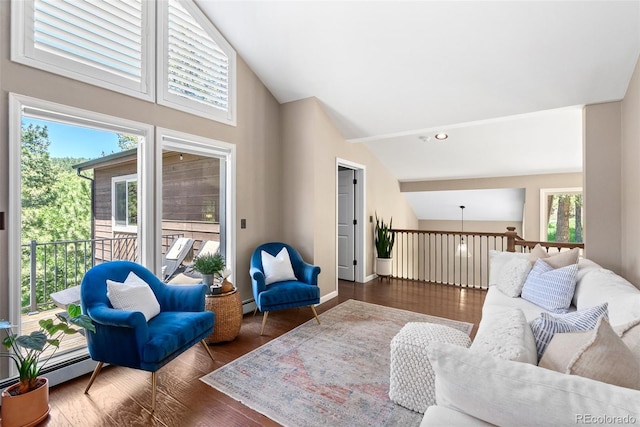 living room with baseboard heating, dark hardwood / wood-style floors, and vaulted ceiling