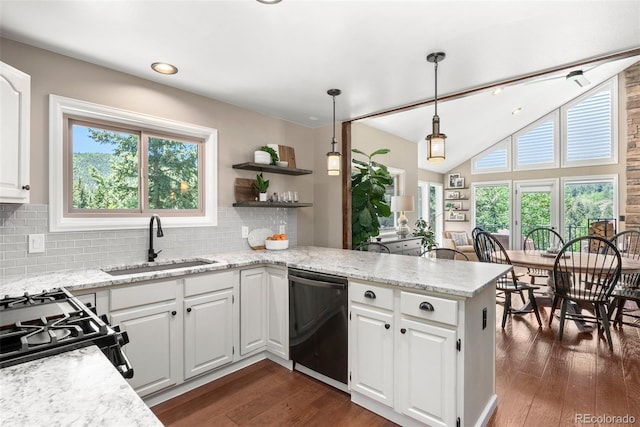 kitchen featuring white cabinetry, black dishwasher, decorative backsplash, decorative light fixtures, and sink