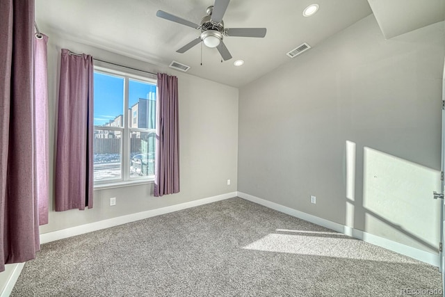 empty room featuring carpet flooring and ceiling fan