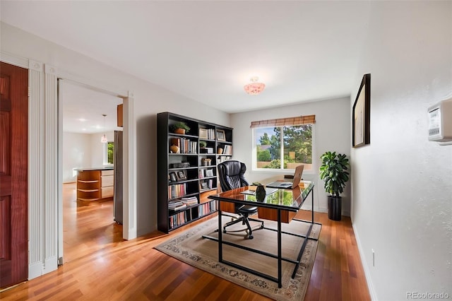 7382 E Bates Dr, Denver, CO 80231 - office with wood finished floors and baseboards