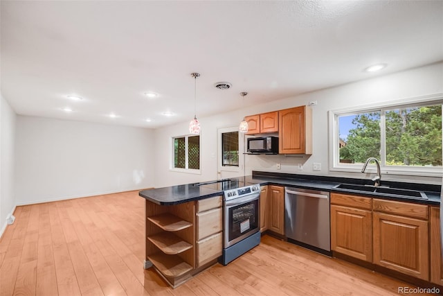 7382 E Bates Dr, Denver, CO 80231 - kitchen featuring appliances with stainless steel finishes, open shelves, dark countertops, a peninsula, and recessed lighting