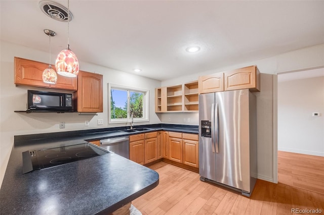 7382 E Bates Dr, Denver, CO 80231 - kitchen featuring appliances with stainless steel finishes, dark countertops, open shelves, light wood finished floors, and pendant lighting
