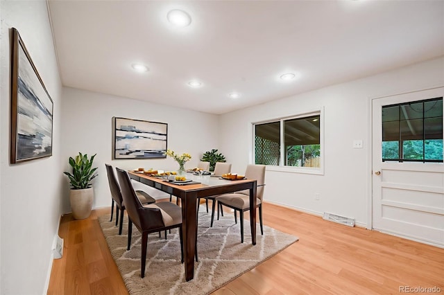 7382 E Bates Dr, Denver, CO 80231 - dining room with light wood finished floors and recessed lighting