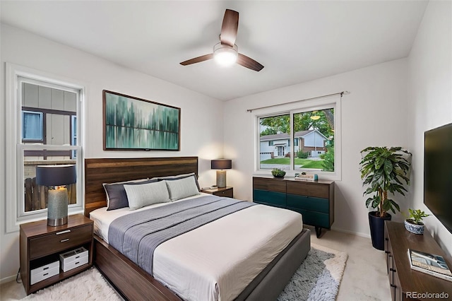 7382 E Bates Dr, Denver, CO 80231 - bedroom featuring light colored carpet and ceiling fan