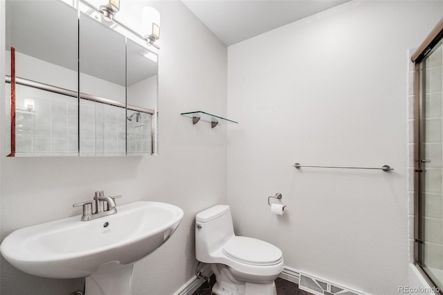 7382 E Bates Dr, Denver, CO 80231 - full bathroom with a sink and a shower with shower door
