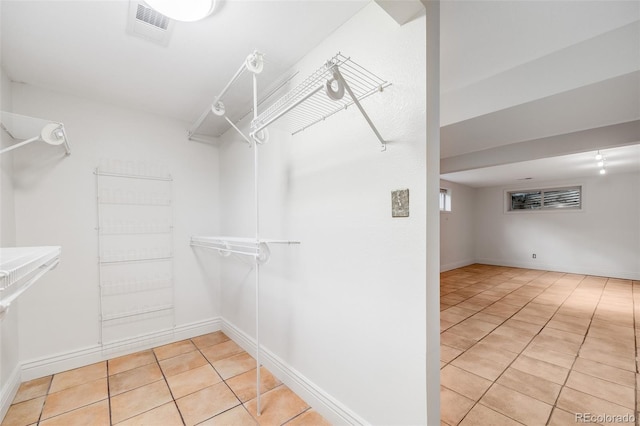 7382 E Bates Dr, Denver, CO 80231 - walk in closet featuring light tile patterned floors