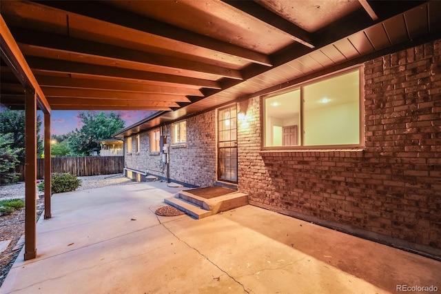 7382 E Bates Dr, Denver, CO 80231 - patio terrace at dusk featuring a patio