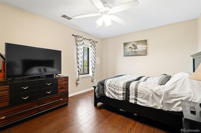 bedroom featuring ceiling fan and dark wood-type flooring