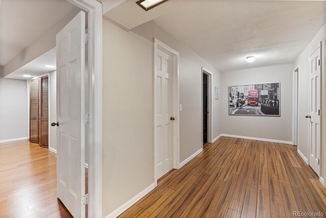 corridor featuring hardwood / wood-style flooring