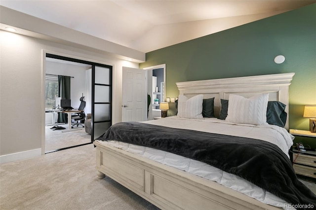 bedroom featuring carpet flooring, lofted ceiling, and a closet