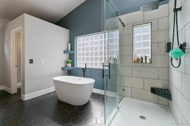 bathroom featuring walk in shower, tile flooring, and tile walls