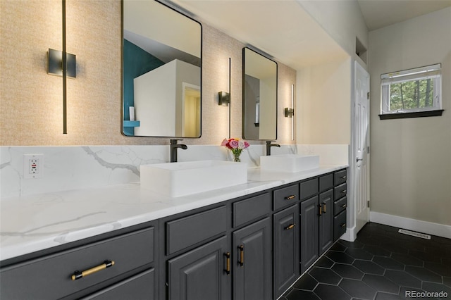 bathroom with tile floors and dual vanity