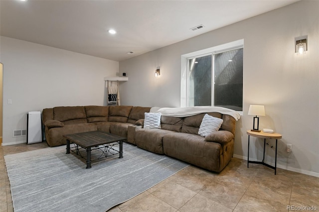 living room featuring light tile floors